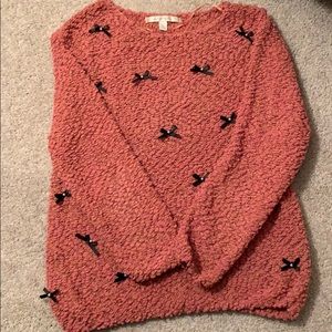 Blush pink sweater with black ribbon bows